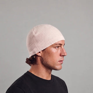 Man wearing the off-white waffle knit skull cap, side view